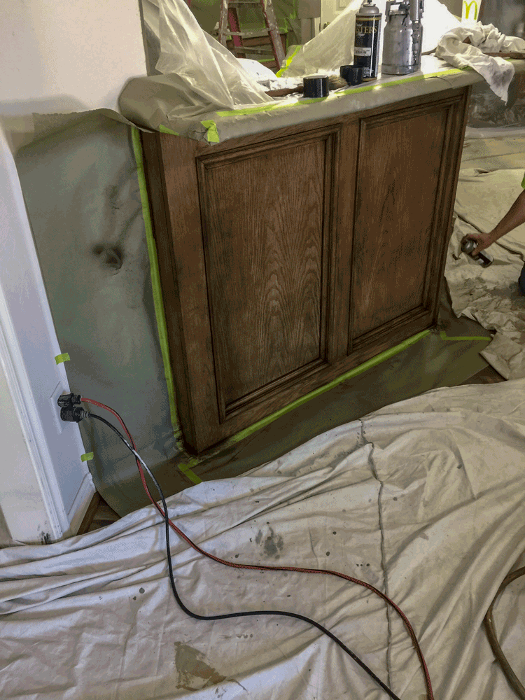 Refinishing cabinets in progress