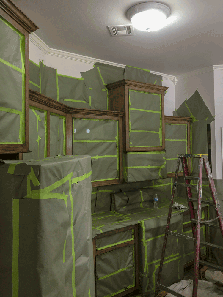 Refinishing cabinets in progress
